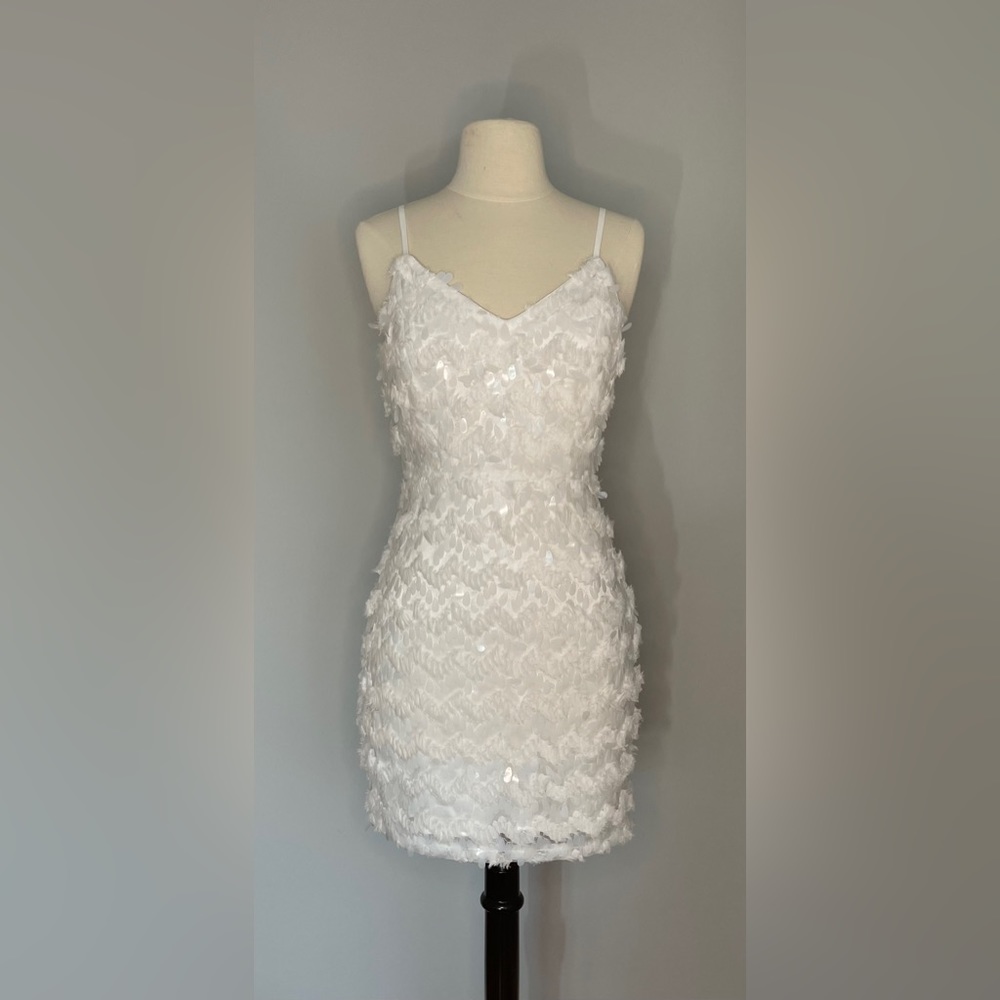 “anything for love” white sequined mini dress from red dress boutique size small